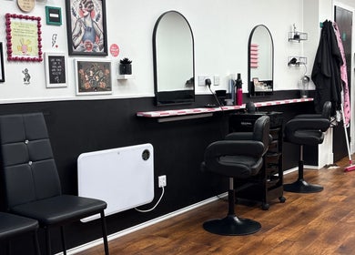 Stylish salon interior at Hair There Jennifer in Inverness, Scotland, GB featuring chic decor and seating.