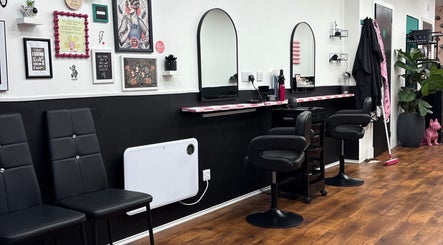 Stylish salon interior at Hair There Jennifer in Inverness, Scotland, GB featuring chic decor and seating.