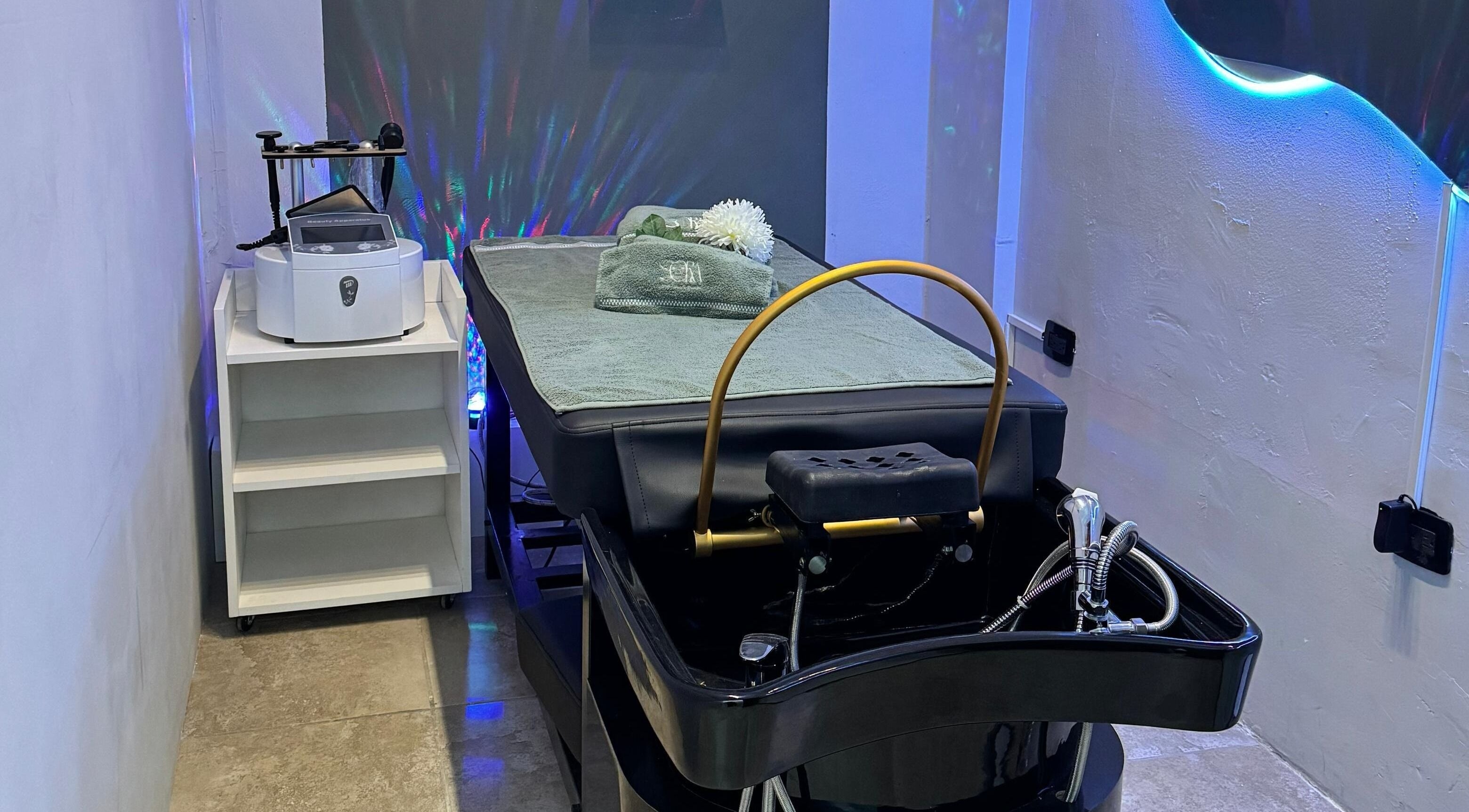 Luxurious spa room at Sora Head Spa Studio® in Playas De Rosarito, Baja California, MX, featuring a massage table.