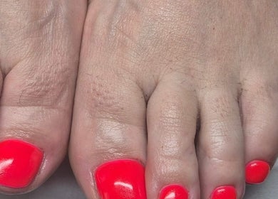 Bright neon pedicure at The Beauty Basement, Pudsey, England, GB, showcasing vibrant nail care.