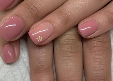 Elegant pink manicure with floral design at The Beauty Basement in Pudsey, England, GB.