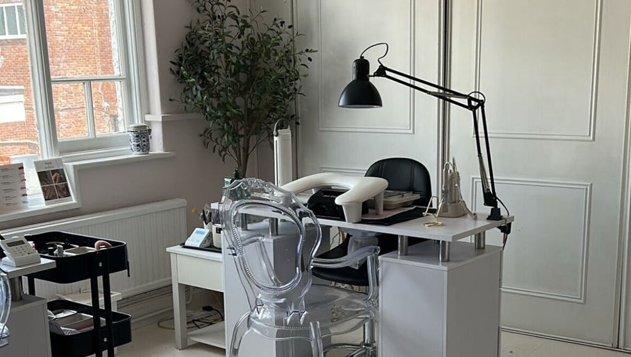 Modern nail station at Ellavated Nailz in Cardiff, Wales, GB, featuring stylish decor and professional setup.