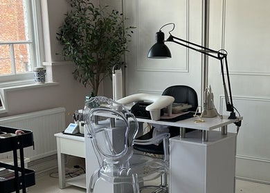 Modern nail station at Ellavated Nailz in Cardiff, Wales, GB, featuring stylish decor and professional setup.