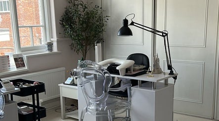 Modern nail station at Ellavated Nailz in Cardiff, Wales, GB, featuring stylish decor and professional setup.
