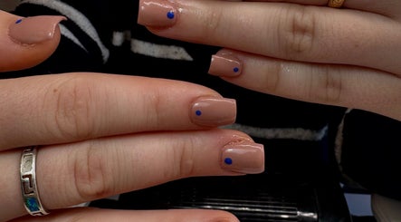 Neutral manicure with blue dot accents at Ellavated Nailz, Cardiff, Wales, GB.