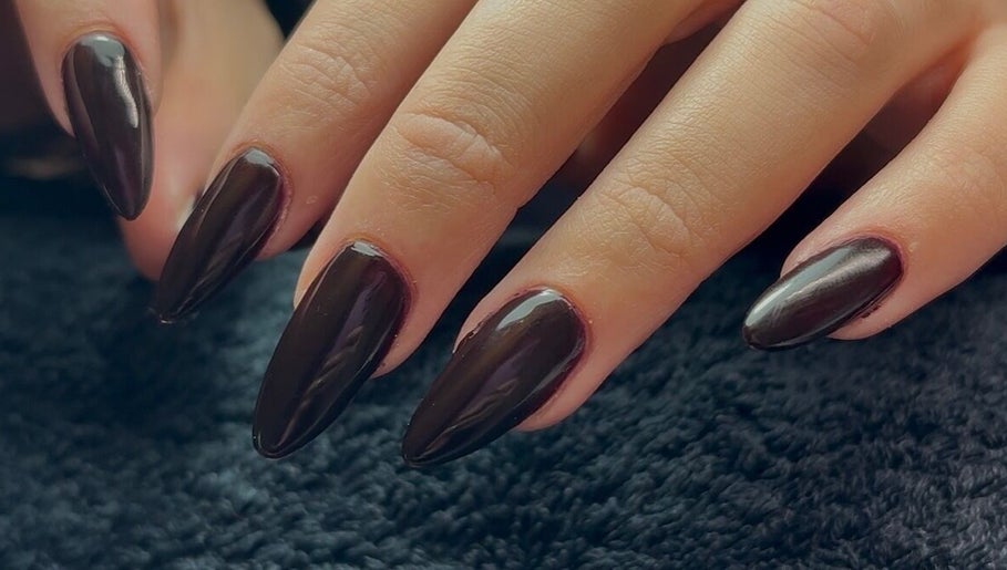 Elegant dark nails at Ellavated Nailz, Cardiff, Wales, GB. Perfect for a chic, sophisticated look.