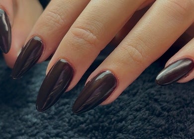 Elegant dark nails at Ellavated Nailz, Cardiff, Wales, GB. Perfect for a chic, sophisticated look.