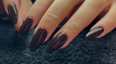 Elegant dark nails at Ellavated Nailz, Cardiff, Wales, GB. Perfect for a chic, sophisticated look.