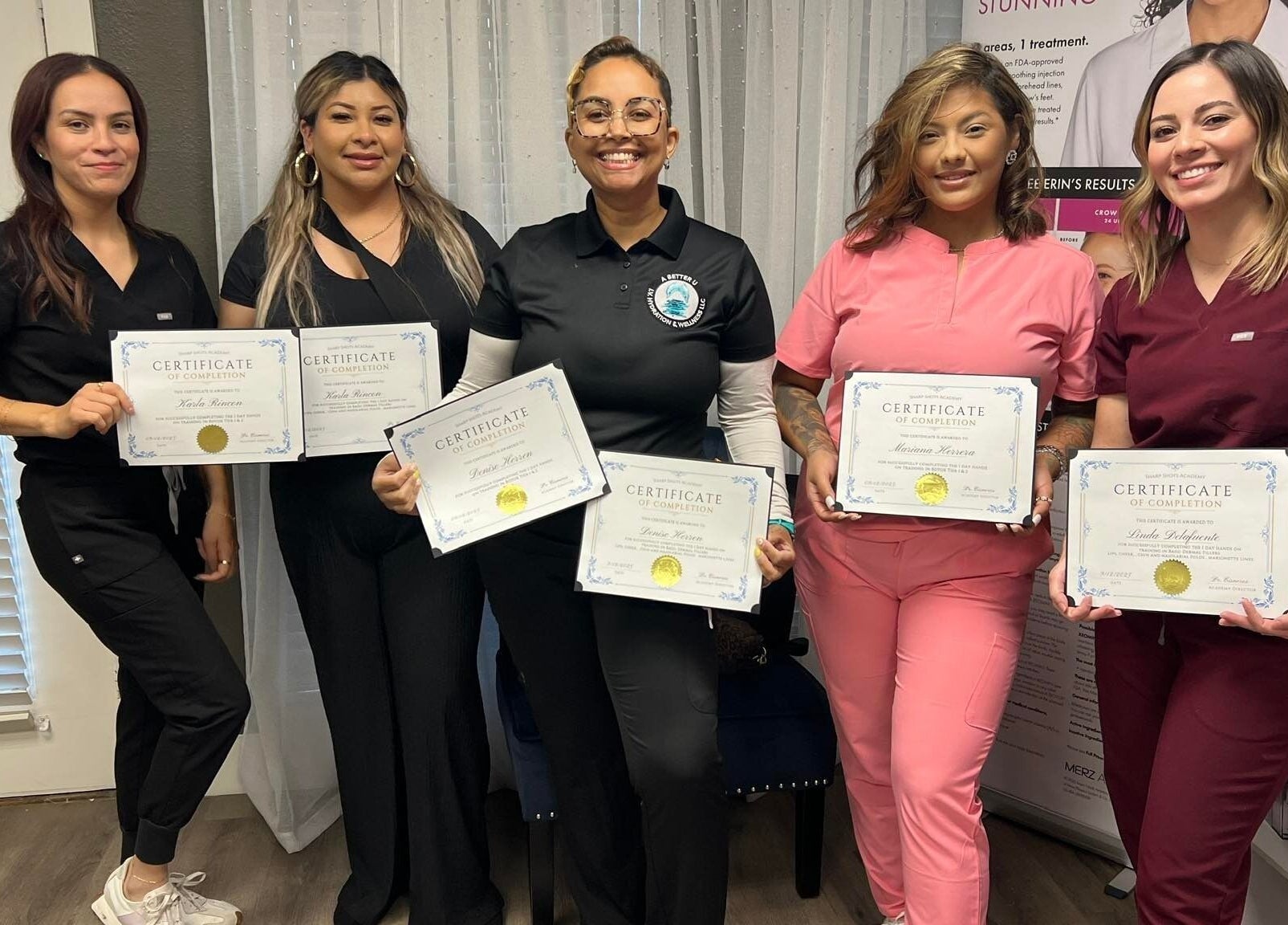 Graduates holding certificates at Sharp Shots Academy & Spa in San Antonio, Texas, US.