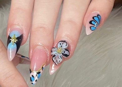 Elegant floral nail art at Nailvana in Cincinnati, Ohio, US showcasing intricate designs and vibrant colors.