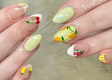 Artistic nails with floral designs at Nailvana, Cincinnati, Ohio, US, showcasing vibrant summer themes.