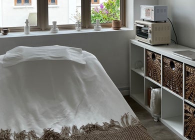 Tranquil spa room at Gentle Cactus, Raffles Place, SG, featuring a calming setup with natural lighting.