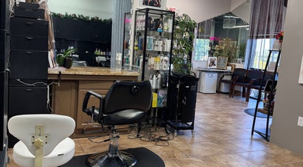 Interior of Lavo Queen Lash & Beauty salon in Lakeway, Texas, US. Stylish chairs and shelves with beauty products.