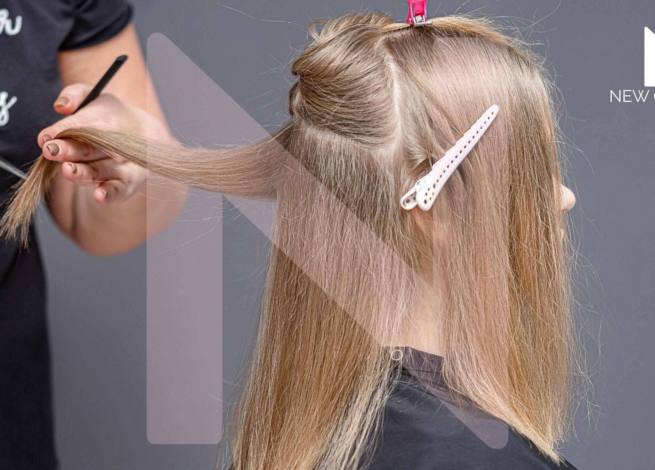 Corte de cabello en New Concept, Heredia, Heredia, CR, mostrando técnica profesional.