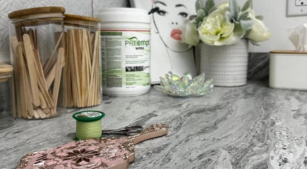 Elegant beauty tools at Aman’s Beauty Bar, Richmond, British Columbia, CA on a marble countertop.