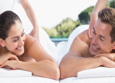 Couple enjoying a relaxing massage at Lido Massage in Gainesville, Georgia, US with a serene natural backdrop.