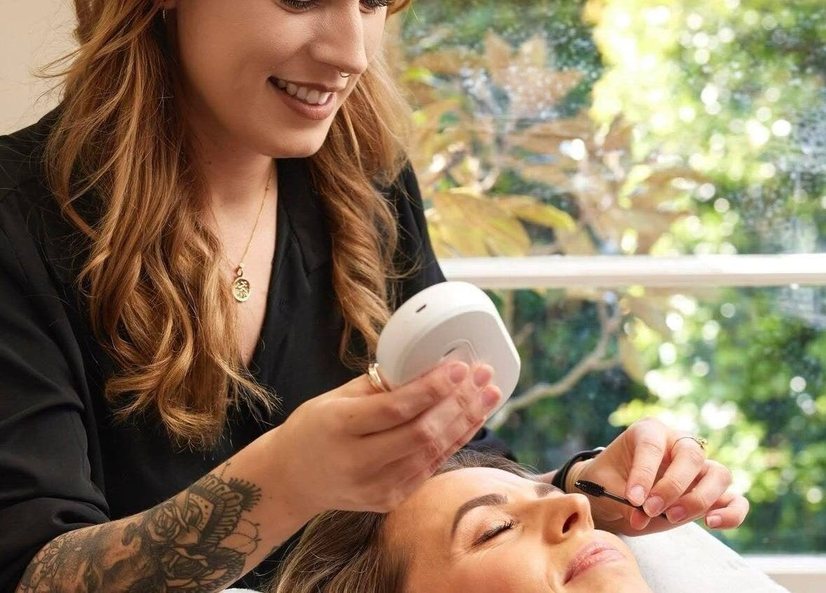 Therapist giving a facial treatment at NOYA Studios, Port Macquarie, New South Wales, AU.