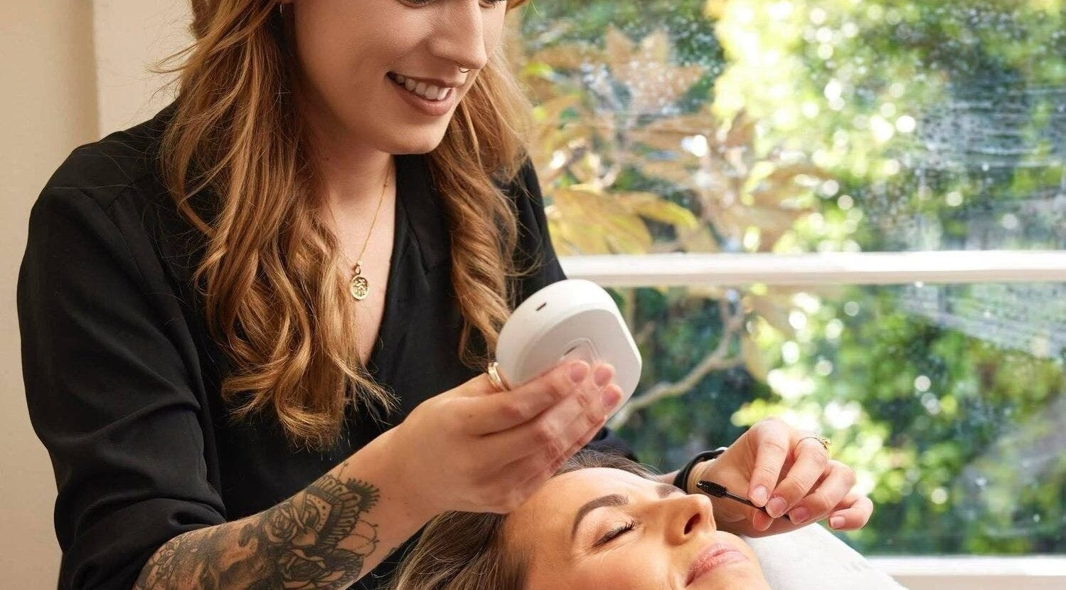 Therapist giving a facial treatment at NOYA Studios, Port Macquarie, New South Wales, AU.