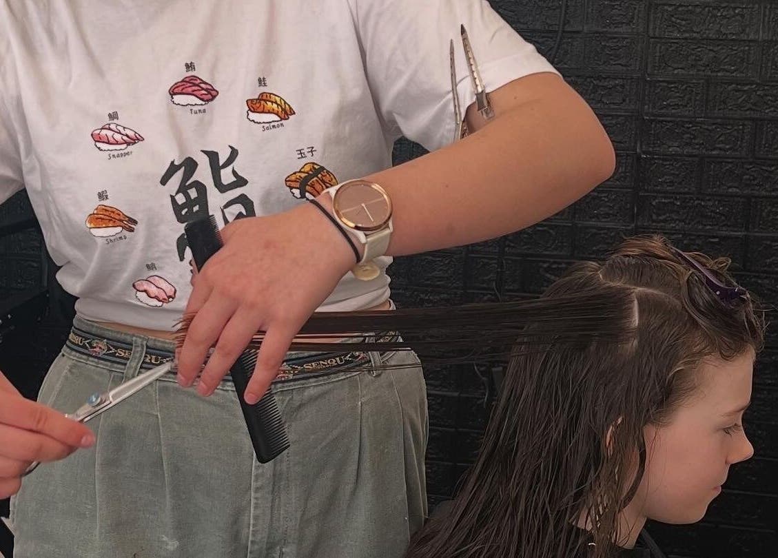 Haircut session at NOYA Studios, Port Macquarie, New South Wales, AU, showcasing detailed hairstyling technique.