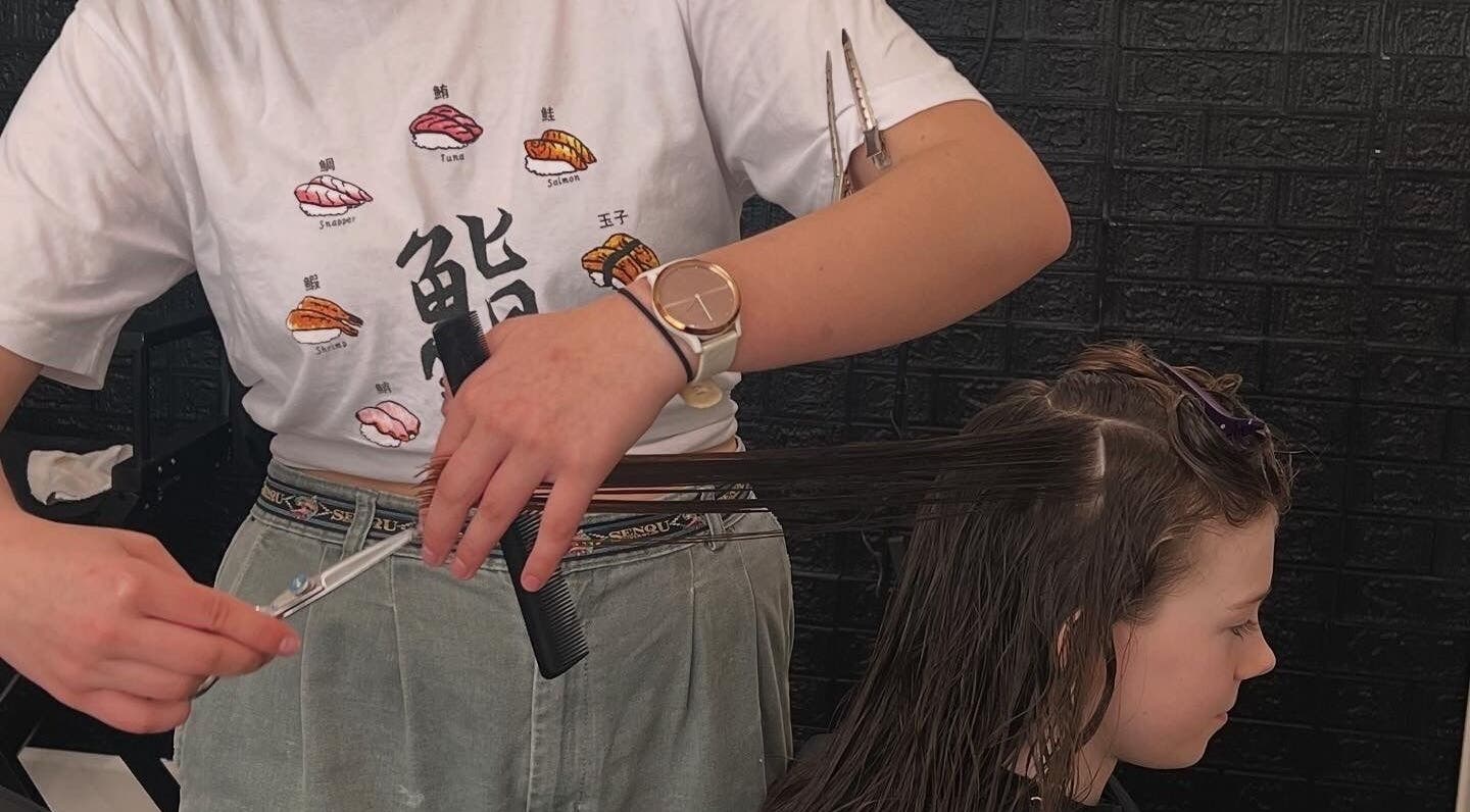 Haircut session at NOYA Studios, Port Macquarie, New South Wales, AU, showcasing detailed hairstyling technique.