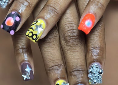 Vibrant nail art from NailVixenKay The Travel Nail Tech in Chicago, Illinois, US, featuring diverse designs.