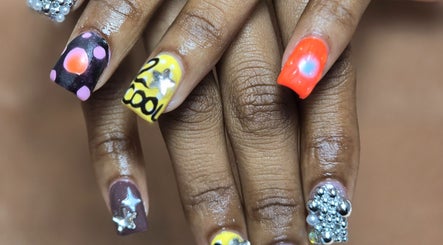 Vibrant nail art from NailVixenKay The Travel Nail Tech in Chicago, Illinois, US, featuring diverse designs.