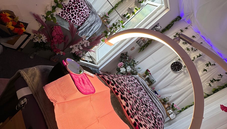 Relaxing beauty treatment room at Eyelashes Bristol, Bristol, England, GB, with floral decor and soft lighting.