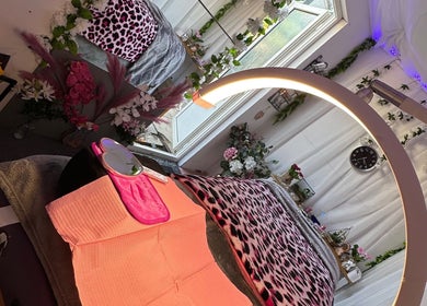 Relaxing beauty treatment room at Eyelashes Bristol, Bristol, England, GB, with floral decor and soft lighting.