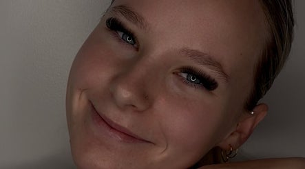 Smiling person showcasing lash extensions at Lasheddbymkk, Melonba, New South Wales, AU.