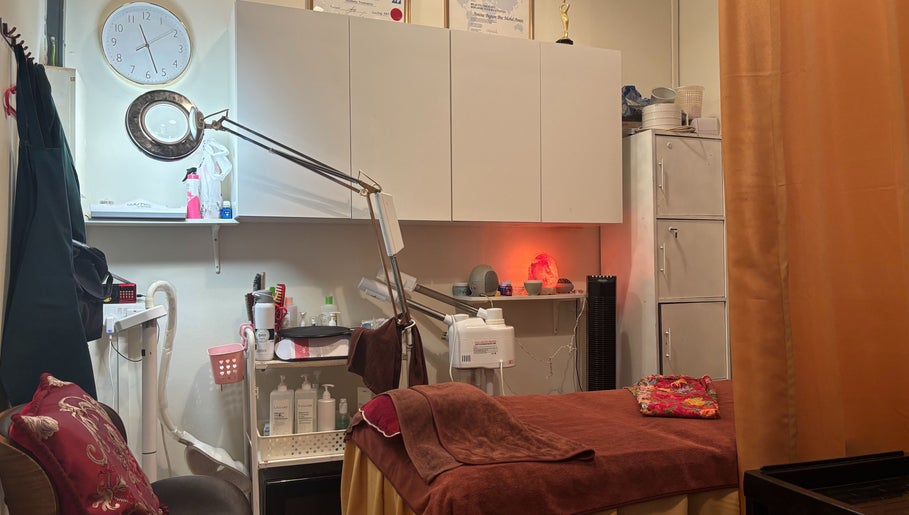 Cozy treatment room at The Beauty Room, Singapore, SG, featuring spa essentials and ambient lighting.