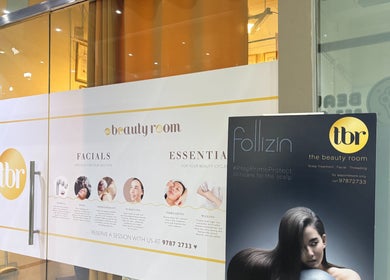 Front entrance of The Beauty Room in Singapore, SG showcasing services like facials and scalp treatments.