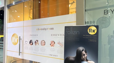 Front entrance of The Beauty Room in Singapore, SG showcasing services like facials and scalp treatments.