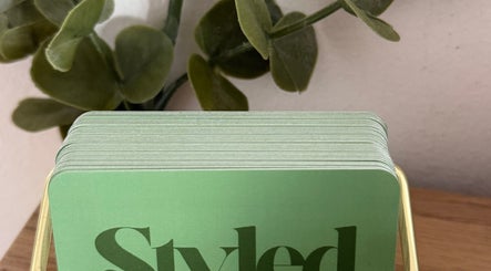 Green cards stack for Styled by Jenna at Blantyre, Scotland, GB, offering unique beauty and wellness services.