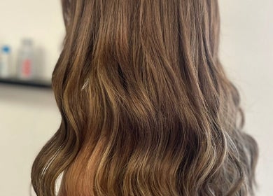 Glossy brunette waves styled at Styled by Jenna, Blantyre, Scotland, GB, showcasing elegant hair styling.