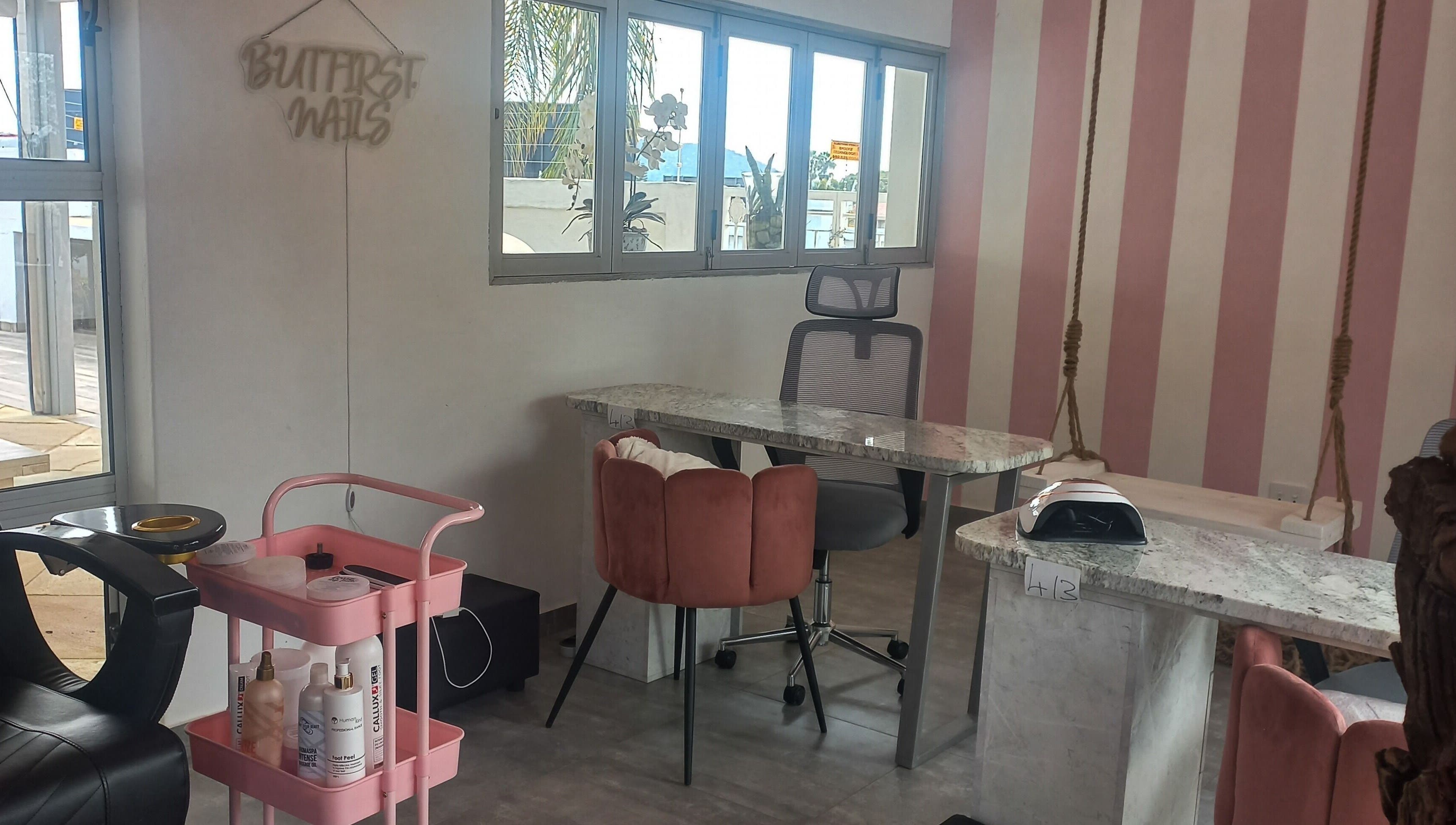 Elegant nail salon interior at Angelique's Aesthetics @ The New James, Pretoria, Gauteng, ZA with pink accents.