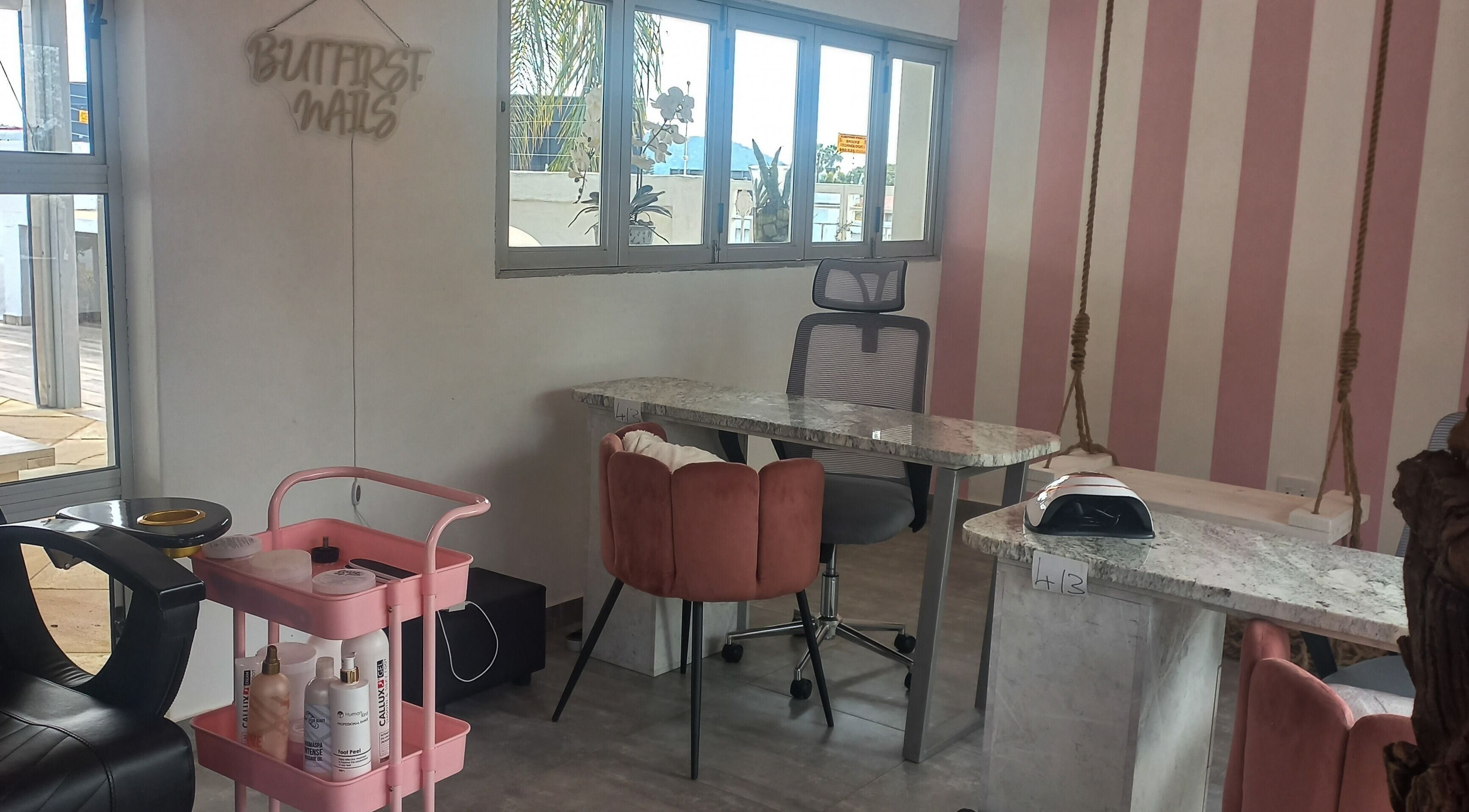 Elegant nail salon interior at Angelique's Aesthetics @ The New James, Pretoria, Gauteng, ZA with pink accents.