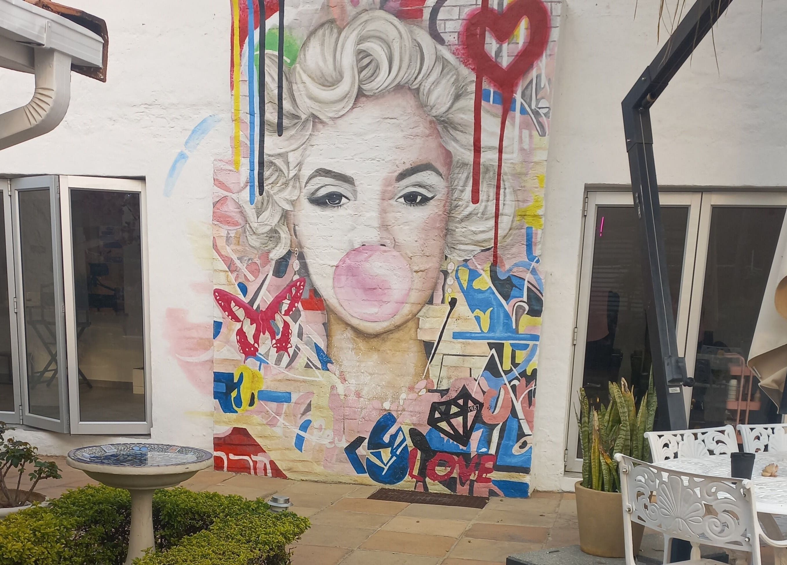 Colorful mural at Angelique's Aesthetics @ The New James, Pretoria, Gauteng, ZA. Brightens the outdoor space.