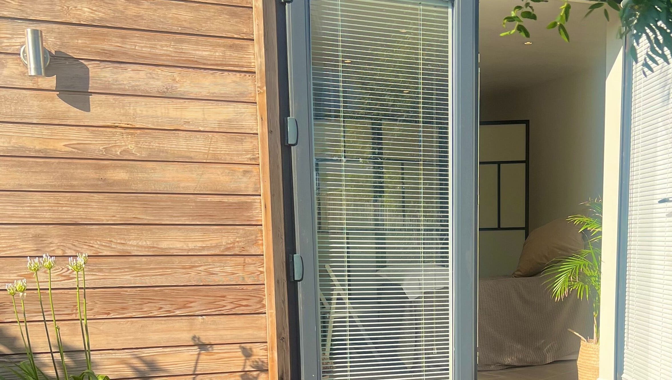 Inviting entrance at Studio Reflex with modern design in Beckenham, England, GB showcasing natural elements.