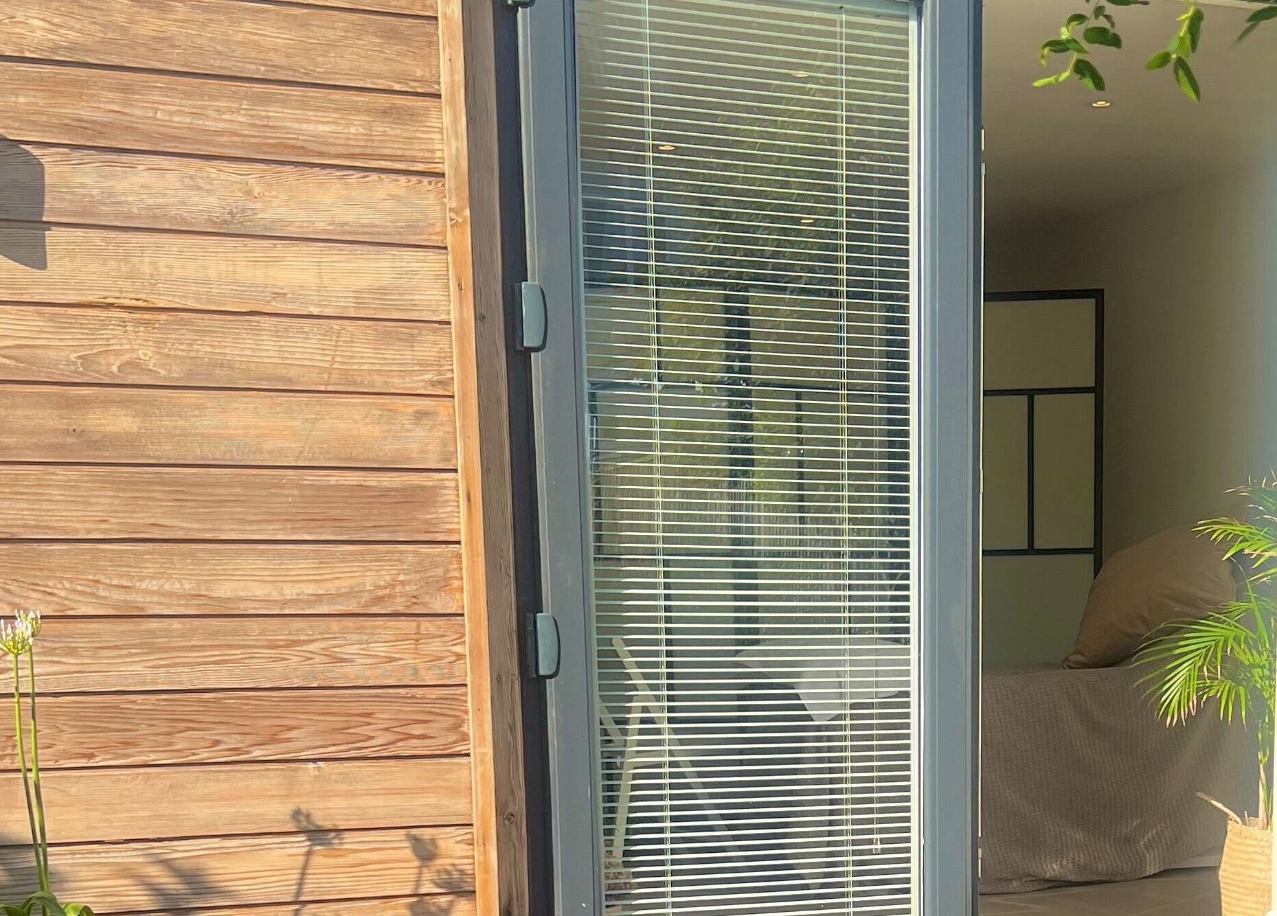 Inviting entrance at Studio Reflex with modern design in Beckenham, England, GB showcasing natural elements.