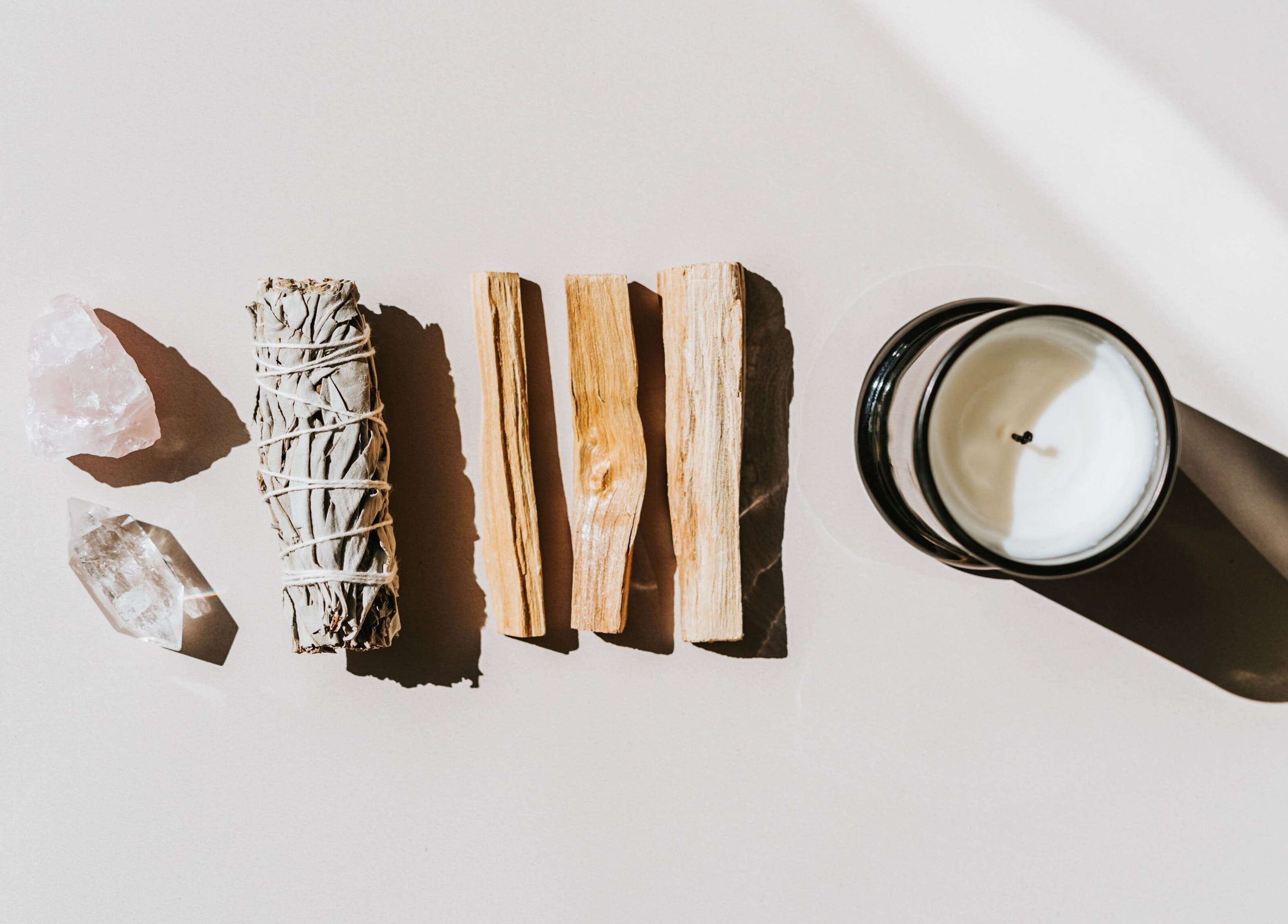 Healing crystals, sage, and candle set at Studio Reflex in Beckenham, England, GB for wellness rituals.