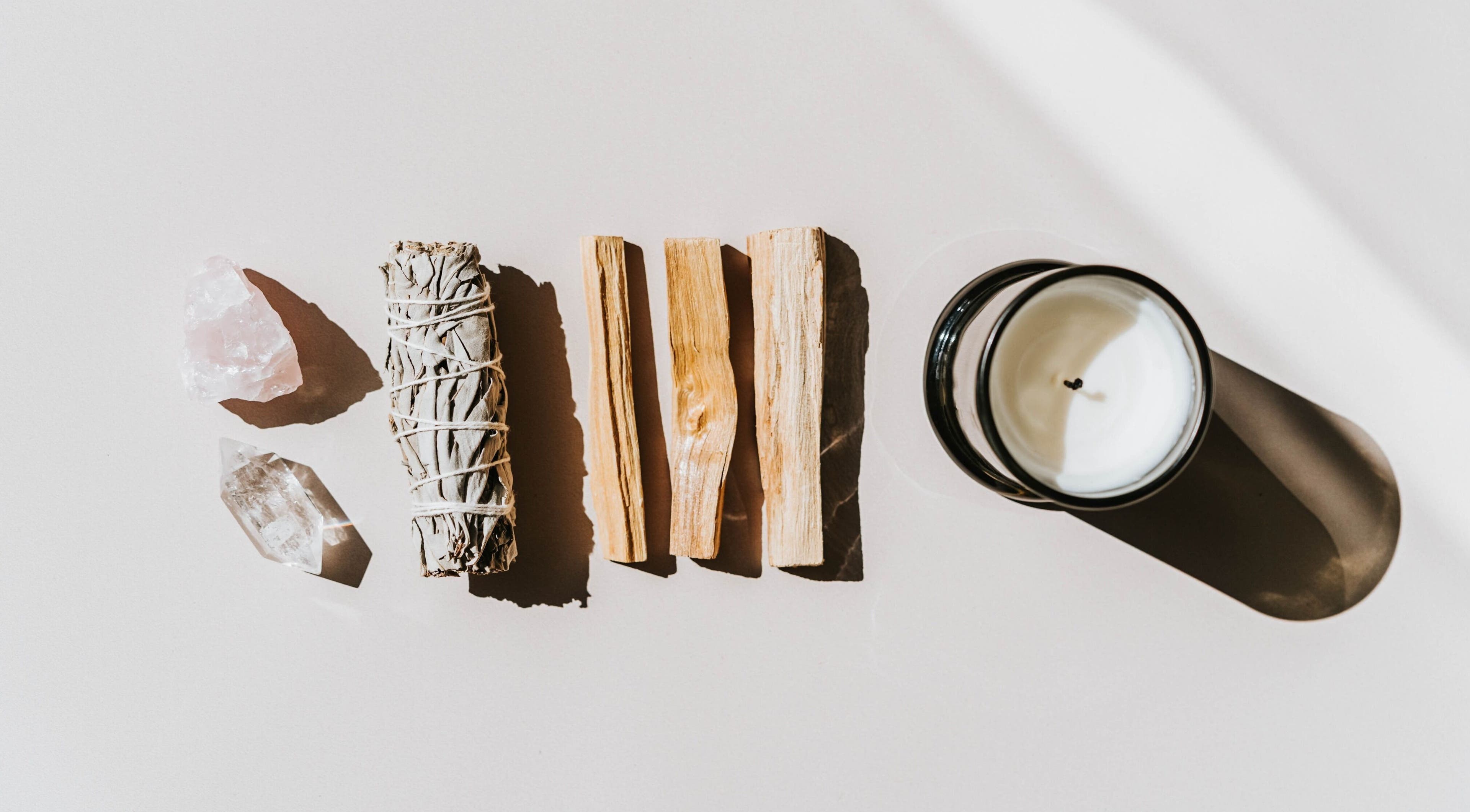 Healing crystals, sage, and candle set at Studio Reflex in Beckenham, England, GB for wellness rituals.