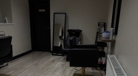 Chic interior of HairBy.E.J.M in Sunderland, England, featuring modern styling chairs and mirrors.