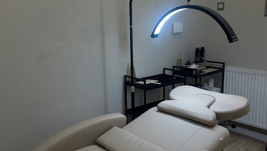 Cozy treatment room at By Annie Madeline, Normanton, England, GB, featuring a massage table and modern decor.