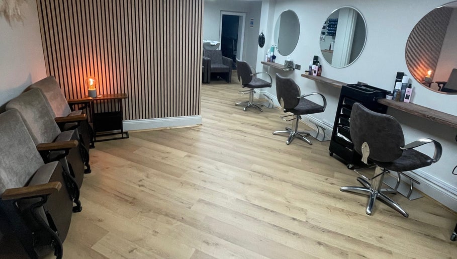 Interior of Coa Hair in York, England, GB featuring modern styling chairs and mirrors.