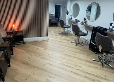Interior of Coa Hair in York, England, GB featuring modern styling chairs and mirrors.