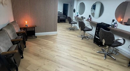 Interior of Coa Hair in York, England, GB featuring modern styling chairs and mirrors.