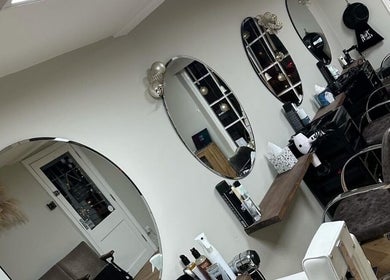 Coa hair salon interior with stylish mirrors and chairs, York, England, GB.