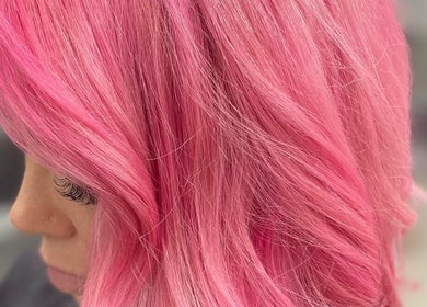 Vibrant pink hairstyle at Coa hair, York, England, GB, showcasing expert coloring and styling.