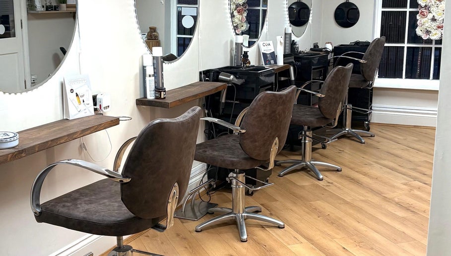 Interior view of Coa Hair showcasing stylish salon chairs and mirrors, York, England, GB.