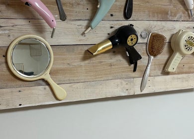 Vintage hair tools and mirror on wood at Coa hair, York, England, GB.